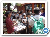 Mr. D. Siva Arun, Programme Assistant issuing Pamphlet to School students 
